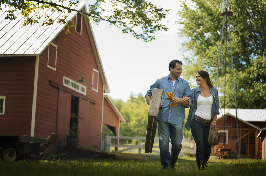 Man and women leaving the barn after a long day